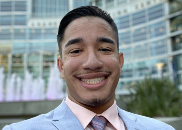 Male electromechanical engineering technology student smiling.