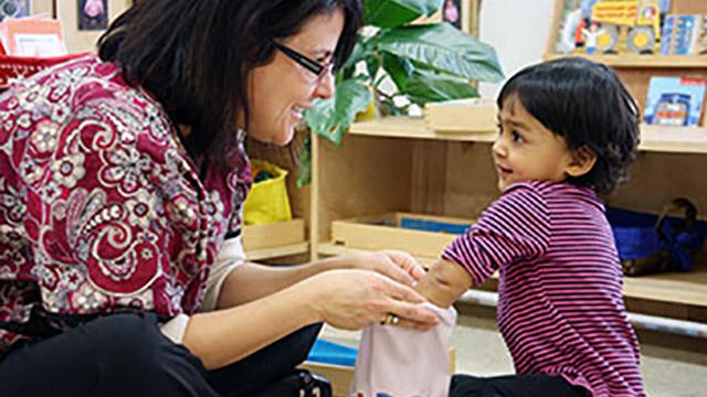 teacher with young child