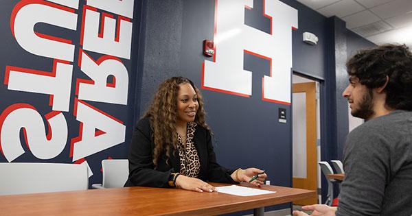 UHart alumni working with student on resume review